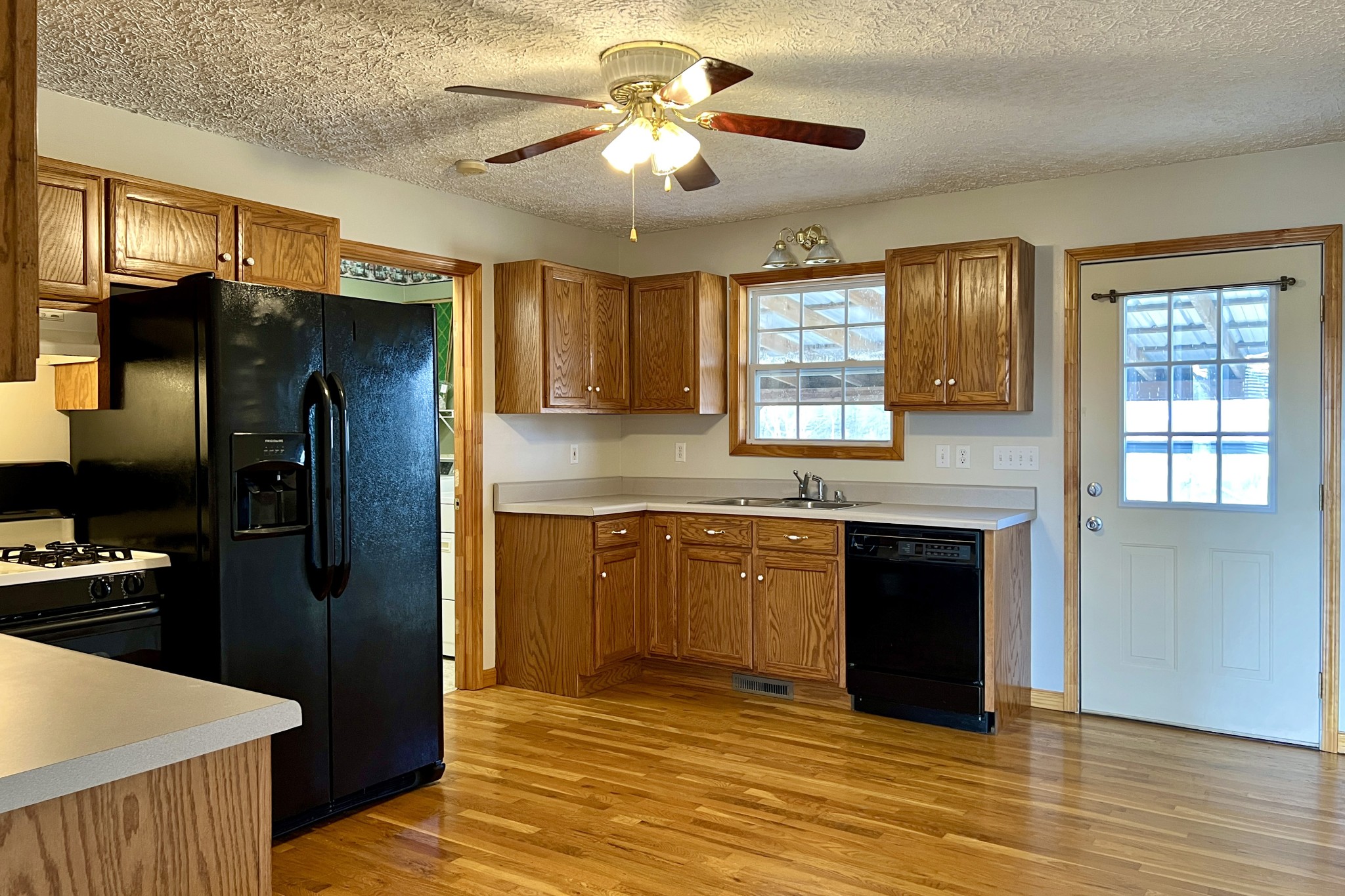 5145 Blackjack Road Franklin, KY 42134 - Photo 7 of 28 a kitchen with stainless steel appliances granite countertop a refrigerator a sink a stove and island