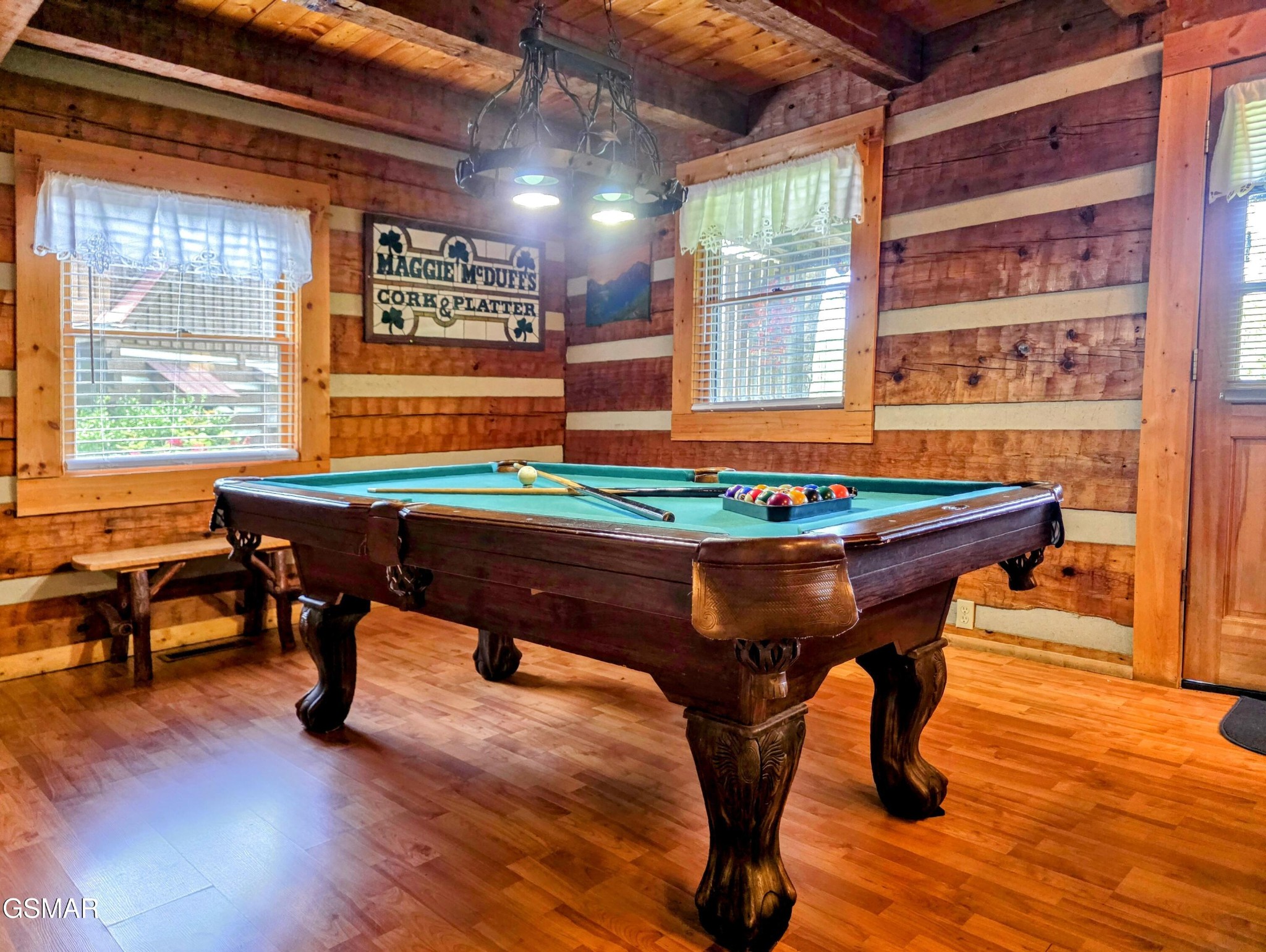 2570 Pittman Center Road Sevierville, TN 37876 - Photo 46 of 61 a room with table chairs and wooden floor