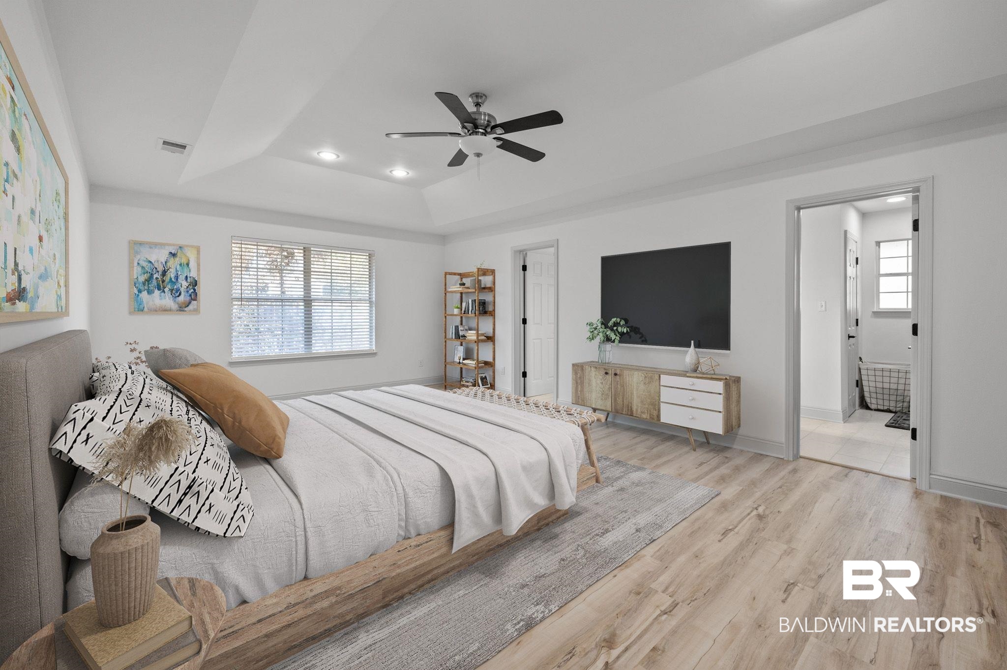 136 Destrehan Road Fairhope, AL 36532 - Photo 44 of 44 Bedroom with light wood-type flooring, ceiling fan, a raised ceiling, and connected bathroom