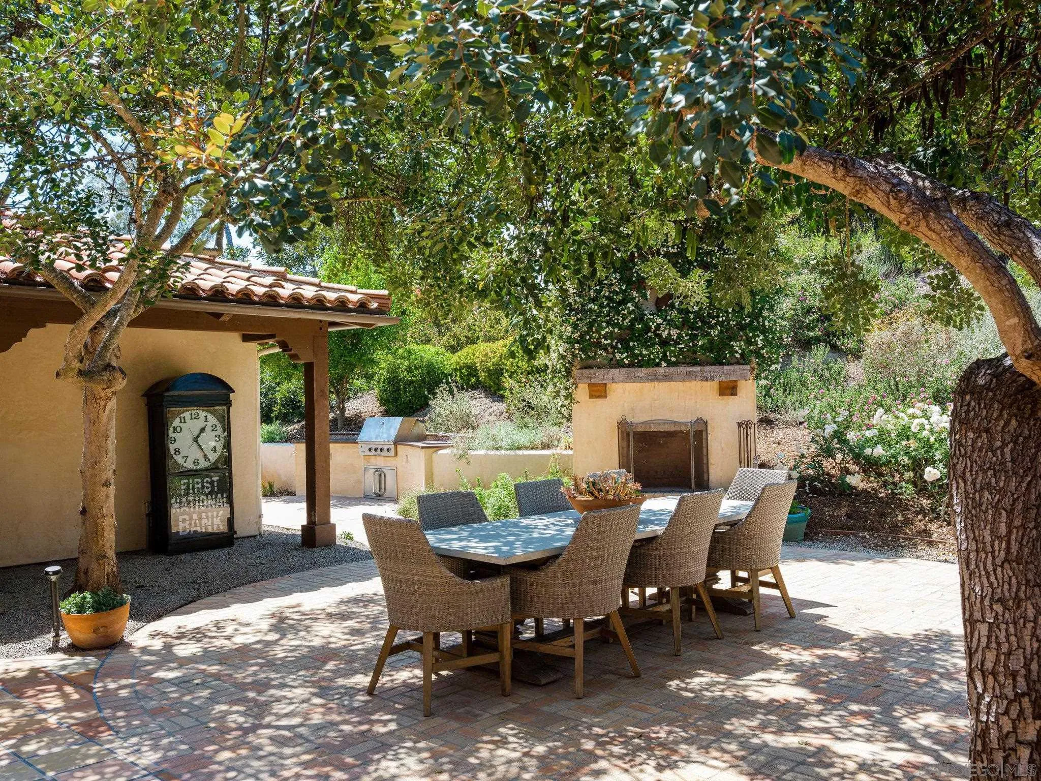16338 Via Del Alba Rancho Santa Fe, CA 92067 - Photo 11 of 46 a view of a patio with a table and chairs
