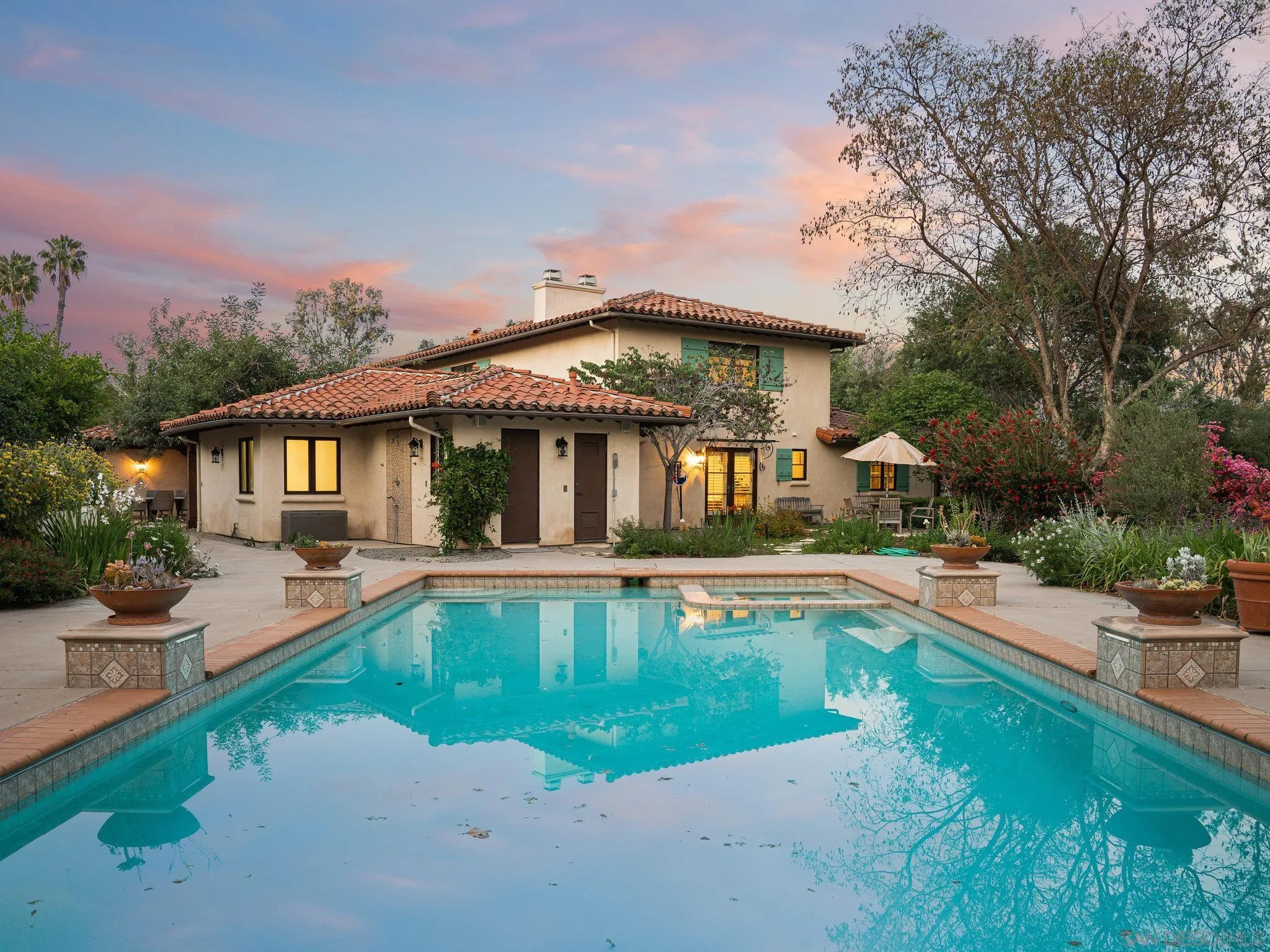 16338 Via Del Alba Rancho Santa Fe, CA 92067 - Photo 13 of 46 a view of a house with swimming pool and sitting area