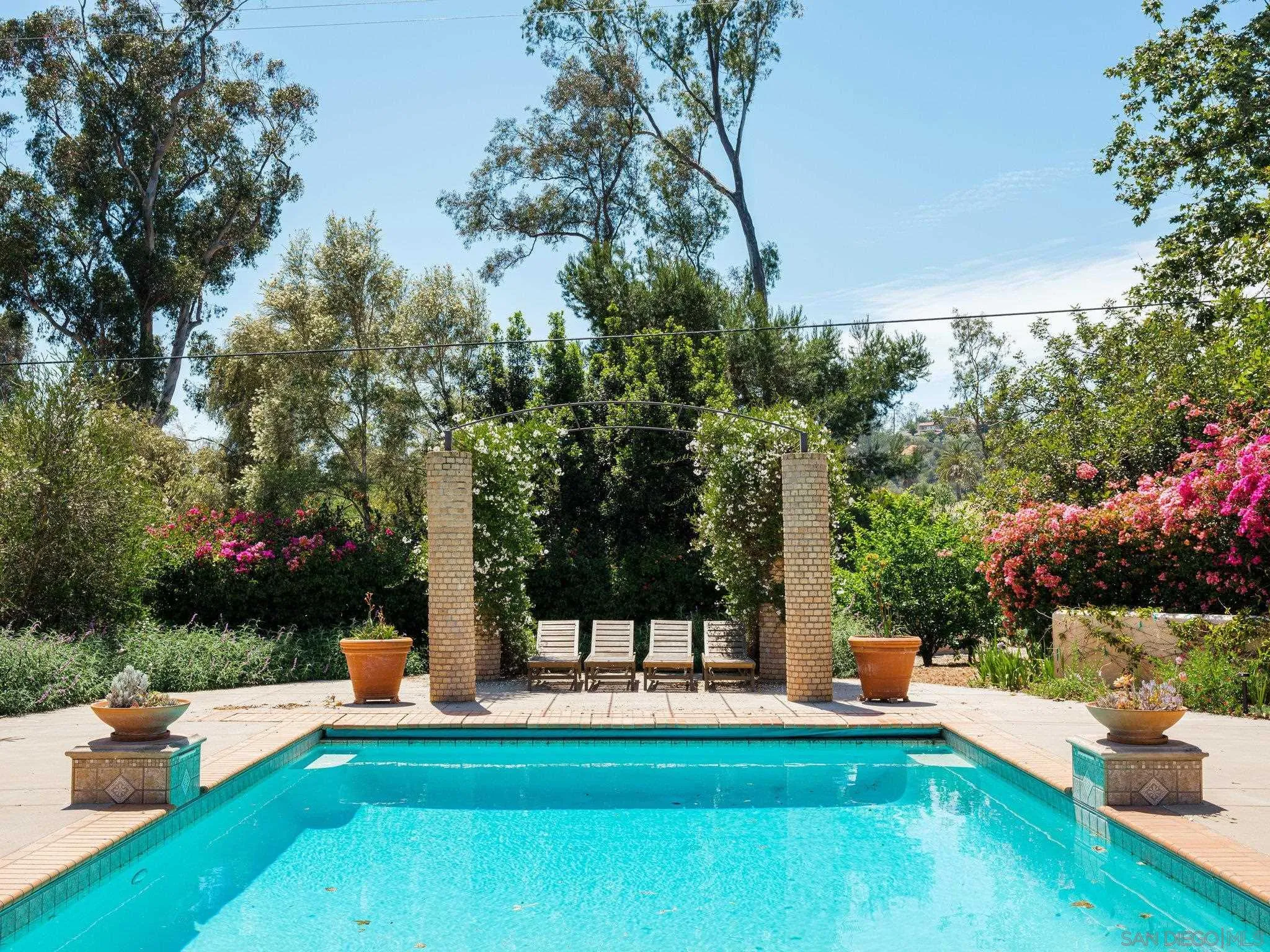 16338 Via Del Alba Rancho Santa Fe, CA 92067 - Photo 14 of 46 a view of a park with plants and bench