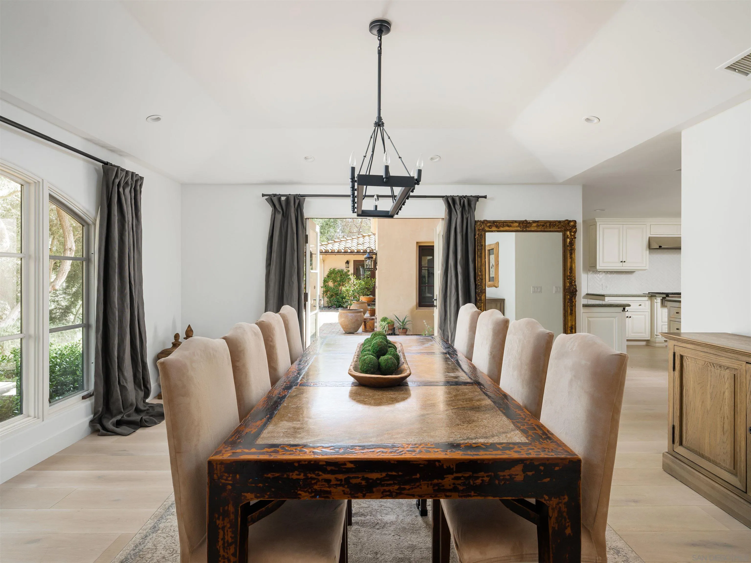 16338 Via Del Alba Rancho Santa Fe, CA 92067 - Photo 35 of 46 a view of a dining room with furniture window and wooden floor