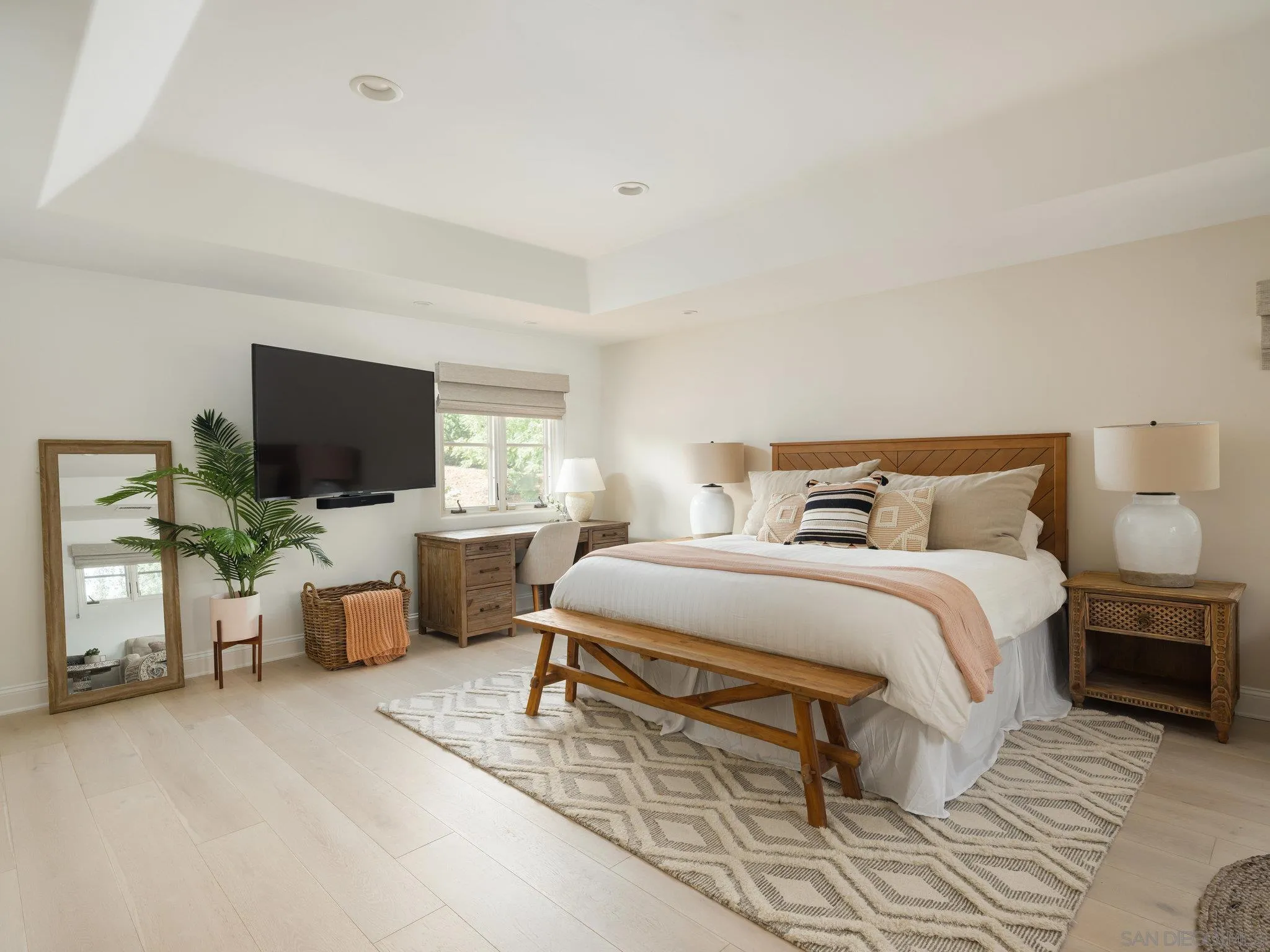 16338 Via Del Alba Rancho Santa Fe, CA 92067 - Photo 38 of 46 a bedroom with a bed and a flat screen tv