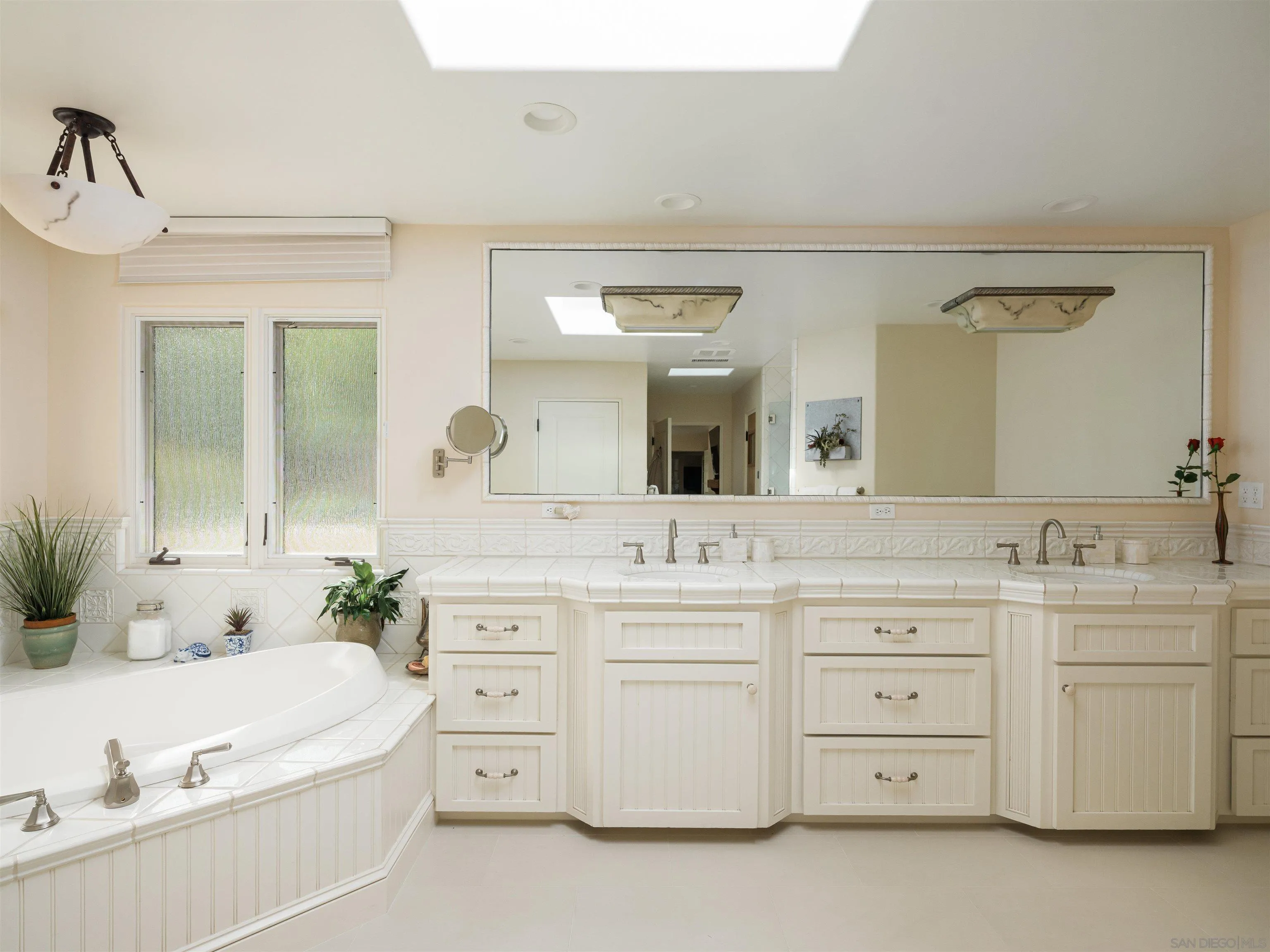 16338 Via Del Alba Rancho Santa Fe, CA 92067 - Photo 39 of 46 a spacious bathroom with a double vanity sink mirror and