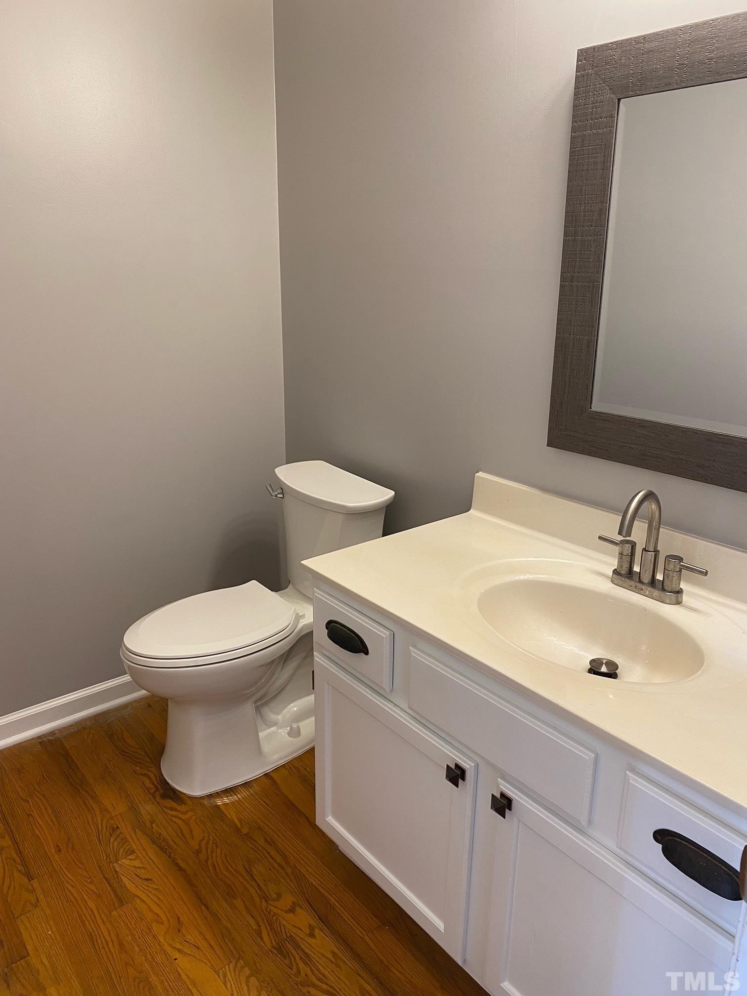 9821 Rockledge Drive Raleigh, NC 27617 - Photo 14 of 26 a bathroom with a sink and a toilet
