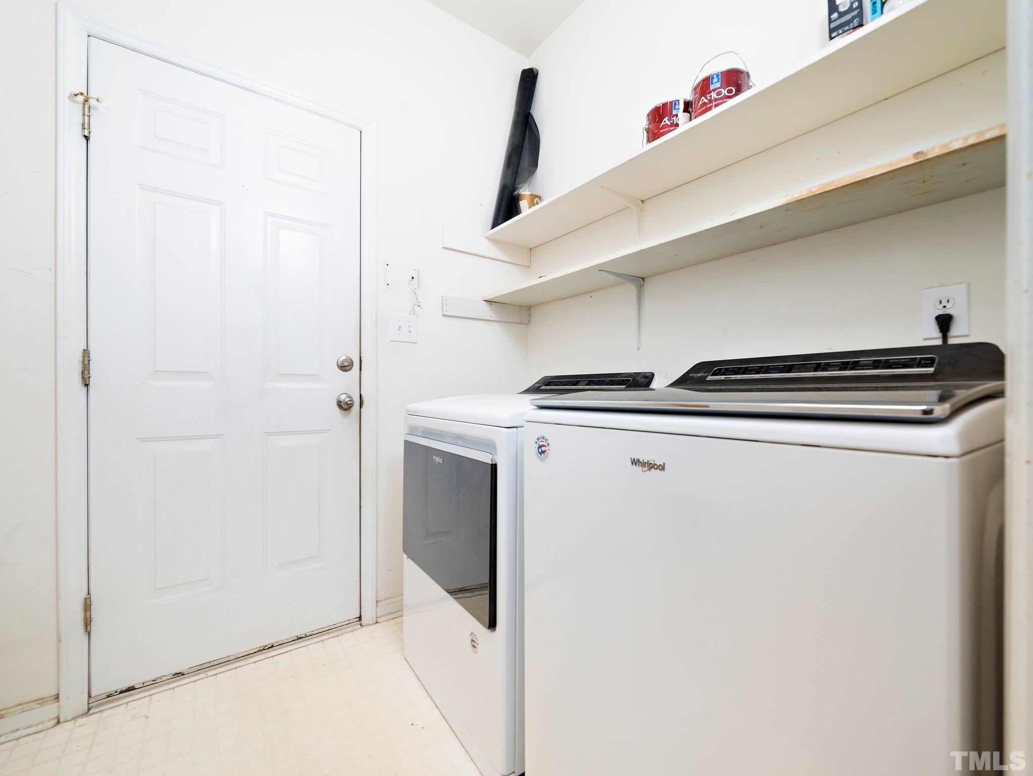9821 Rockledge Drive Raleigh, NC 27617 - Photo 15 of 26 a utility room with dryer and washer