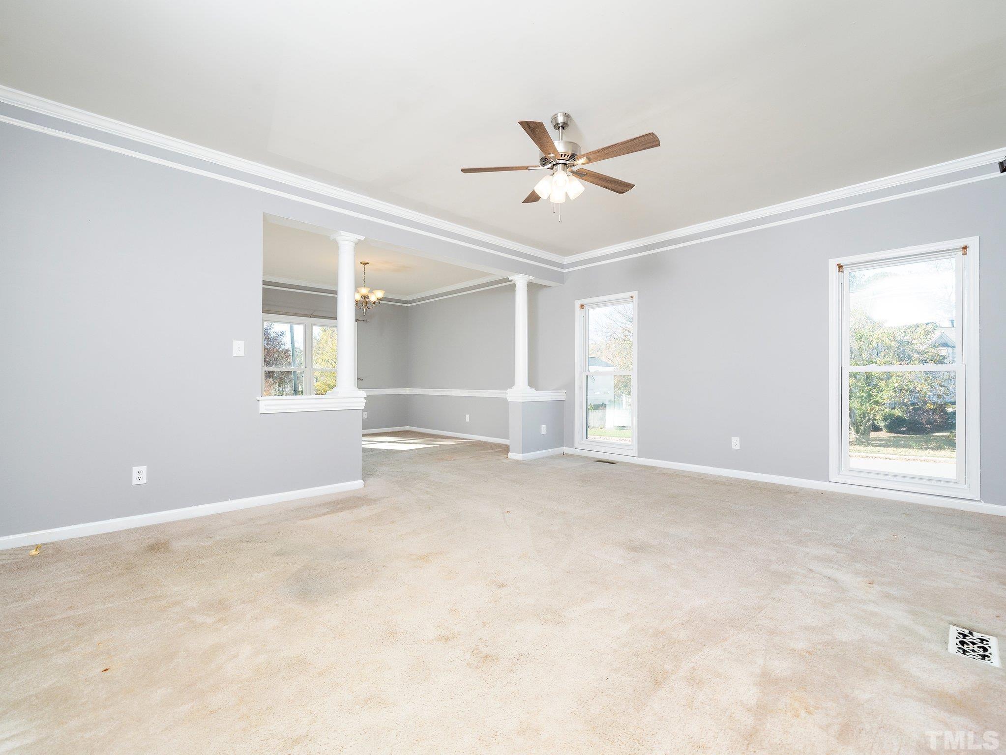 9821 Rockledge Drive Raleigh, NC 27617 - Photo 5 of 26 a view of an empty room with a window