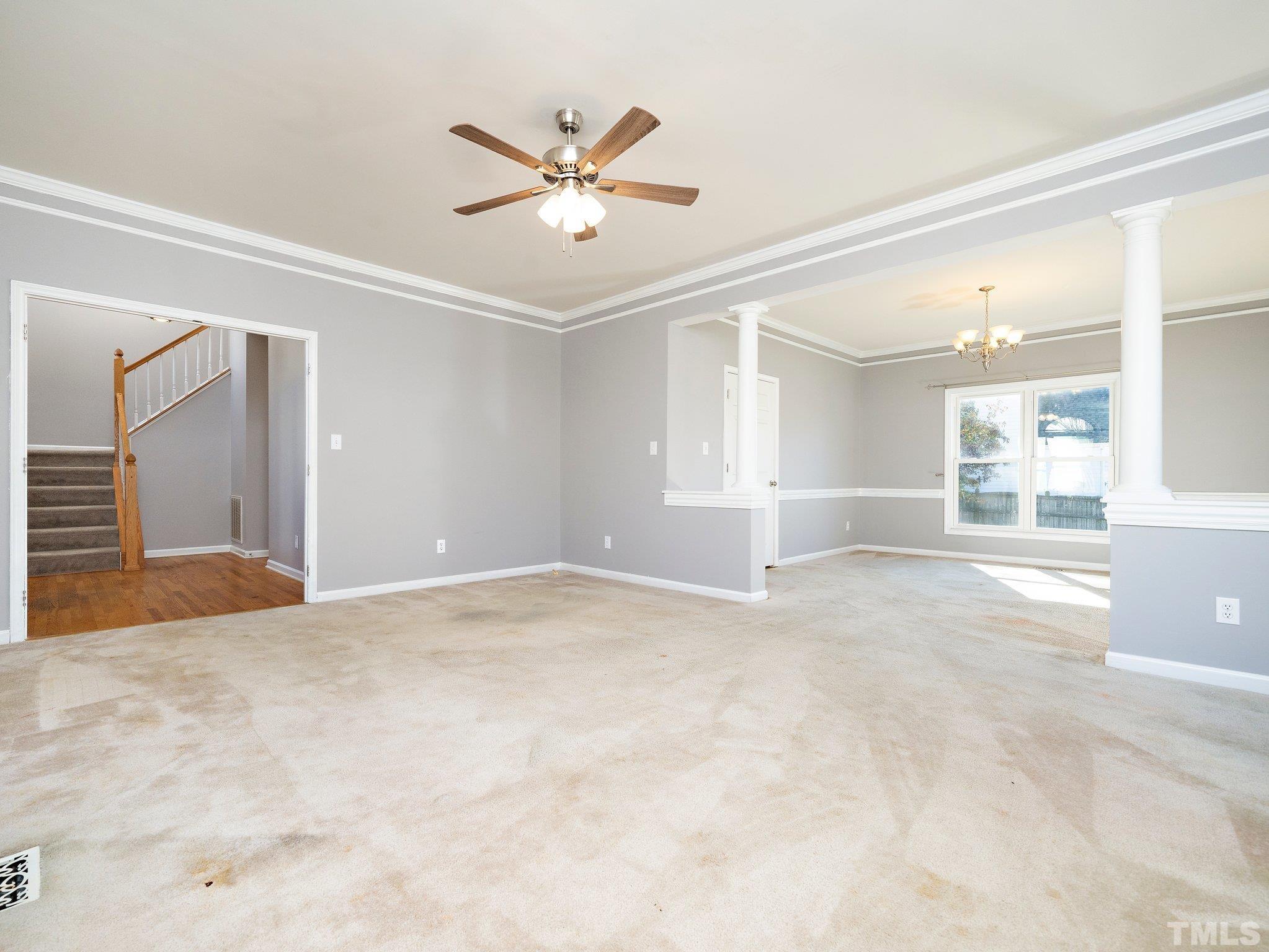9821 Rockledge Drive Raleigh, NC 27617 - Photo 7 of 26 a view of an empty room with a window