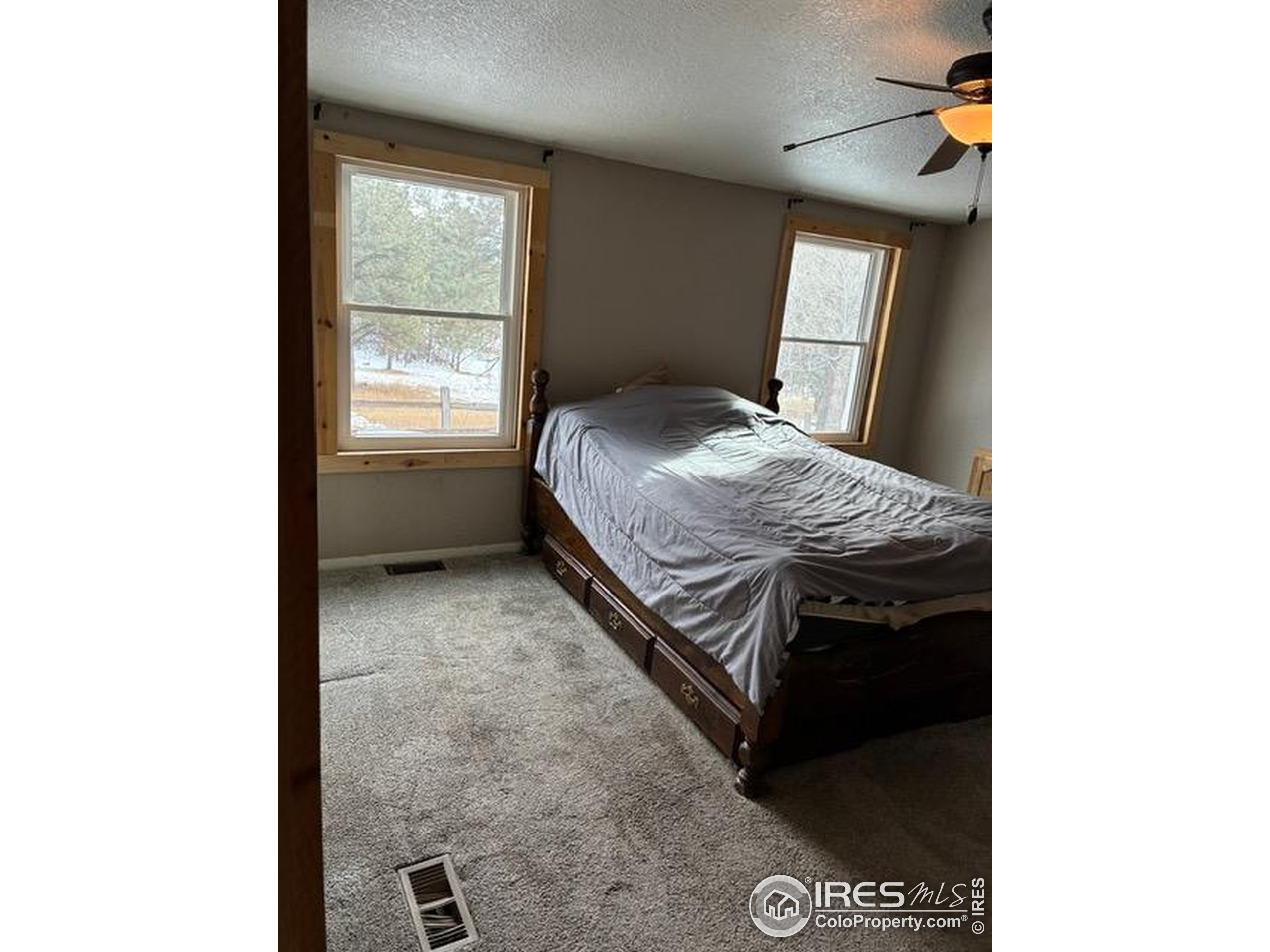 1759 Arapahoe Drive Florissant, CO 80816 - Photo 17 of 40 a bedroom with a bed and window