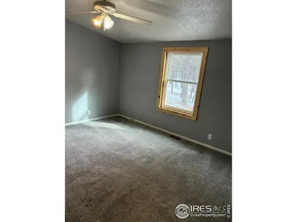 a view of a room with a hallway