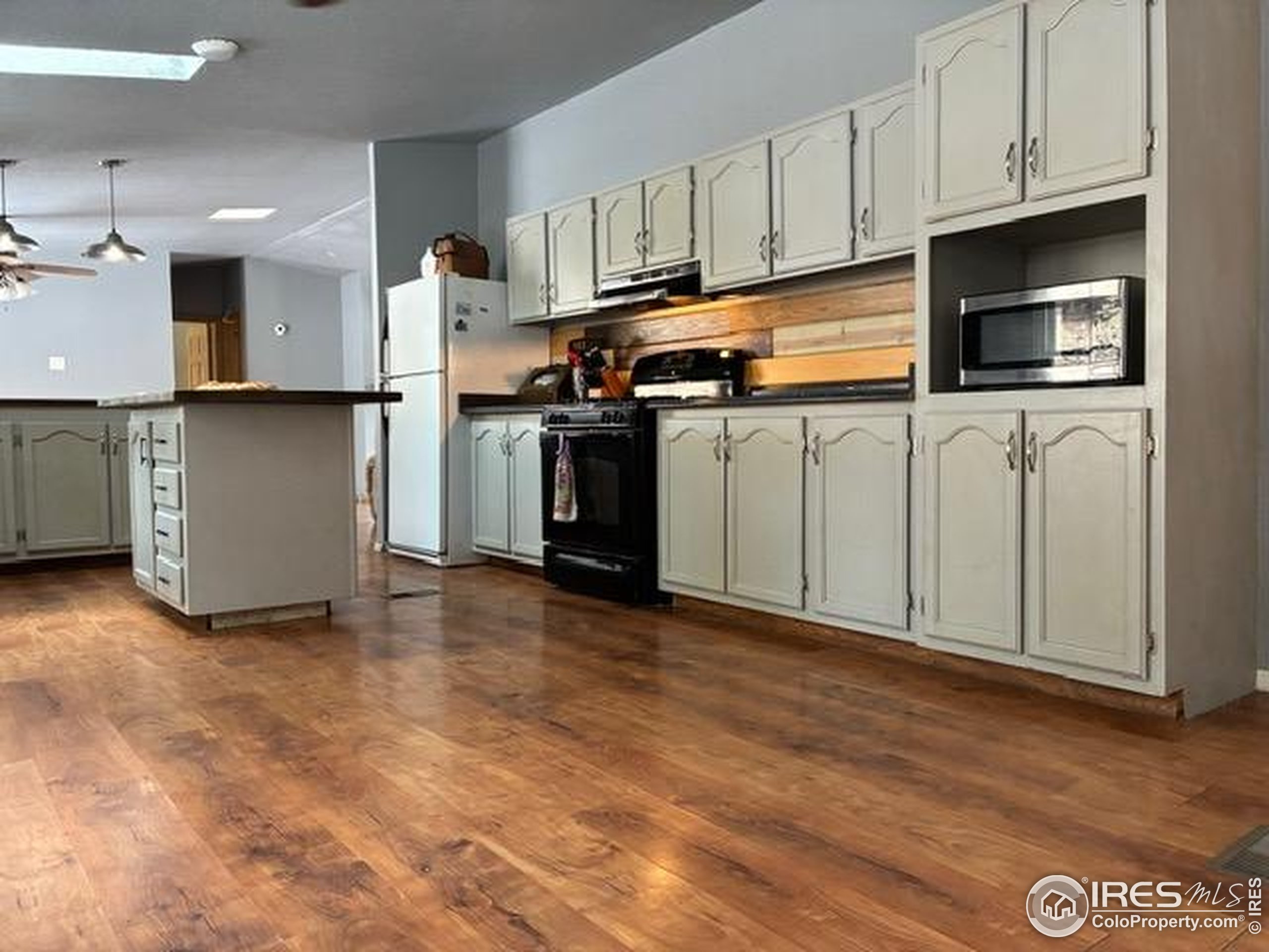 1759 Arapahoe Drive Florissant, CO 80816 - Photo 4 of 40 a kitchen with stainless steel appliances granite countertop a refrigerator a stove top oven a sink and dishwasher