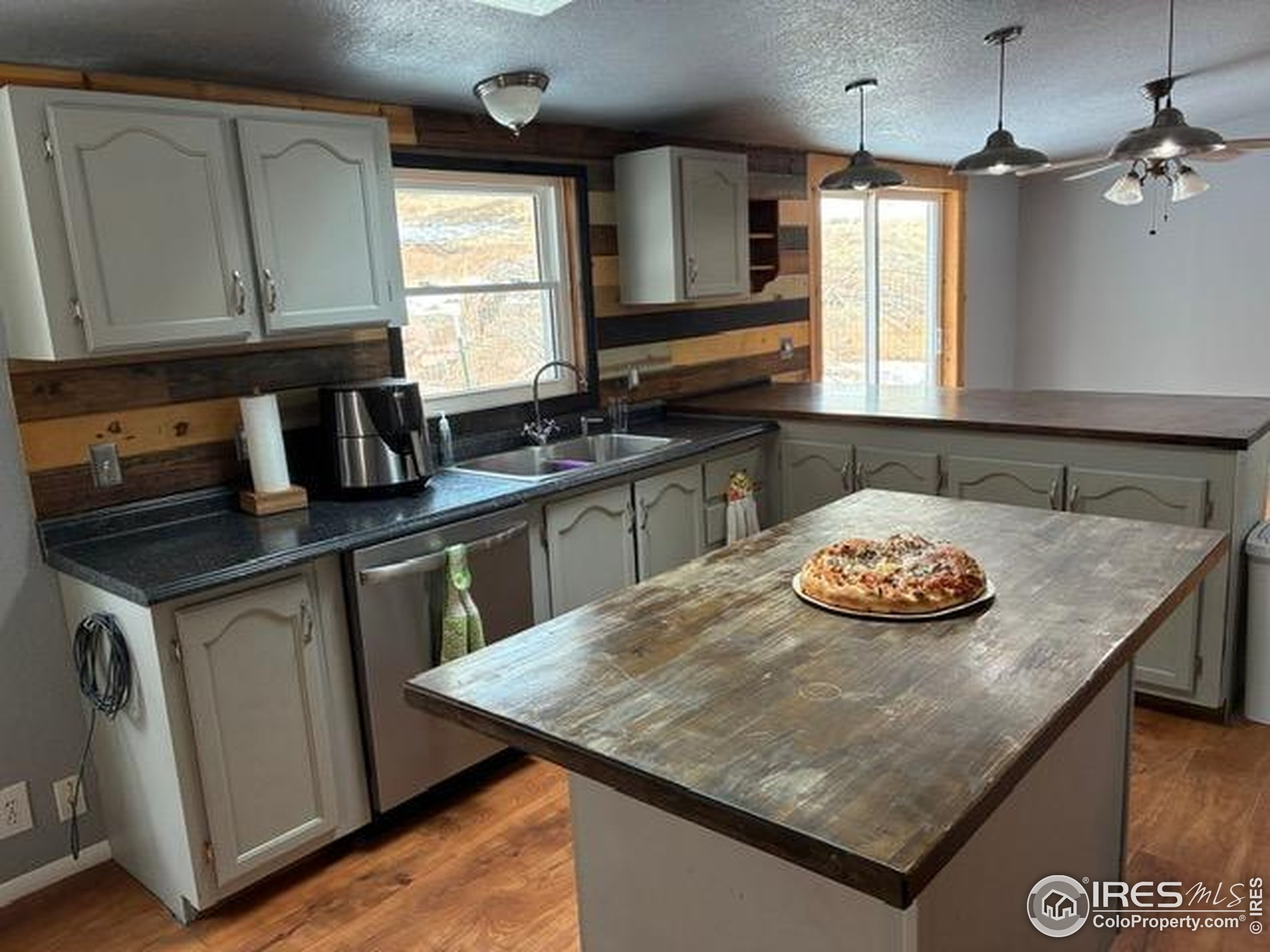 1759 Arapahoe Drive Florissant, CO 80816 - Photo 5 of 40 a kitchen with a stove and a sink