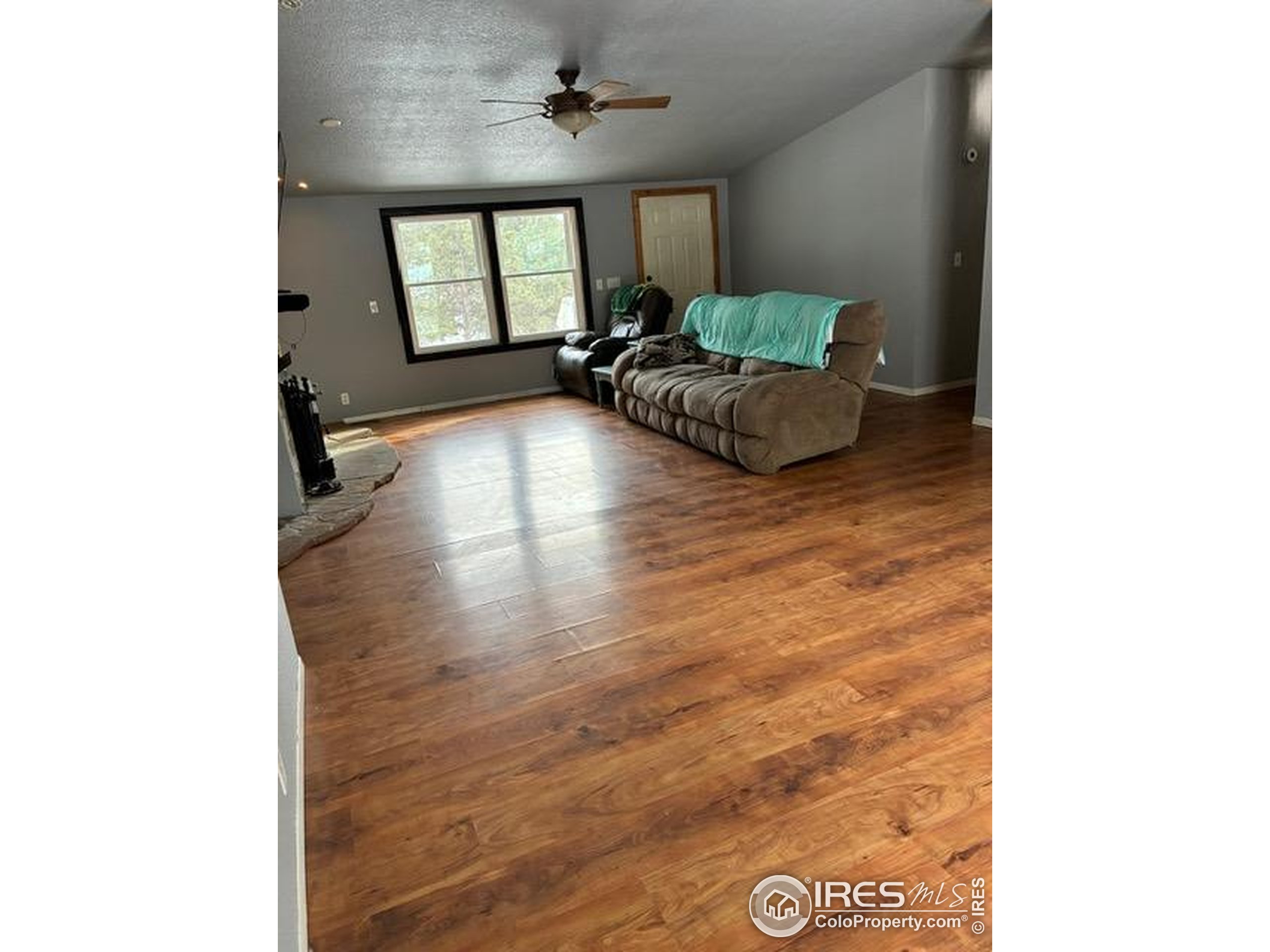 1759 Arapahoe Drive Florissant, CO 80816 - Photo 10 of 40 a living room with furniture and a large window