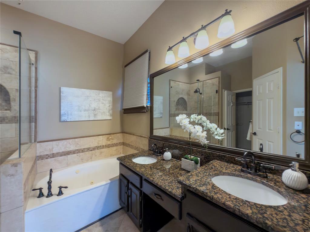 4234 Timberglen Road Dallas, TX 75287 - Photo 20 of 32 Bathroom featuring a double vanity with granite countertops, undermount sinks, and oil-rubbed bronze fixtures