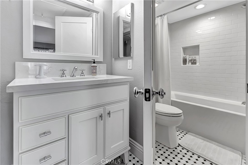 34014 Selva Road, Unit 19 Dana Point, CA 92629 - Photo 13 of 19 a bathroom with a sink a toilet and shower