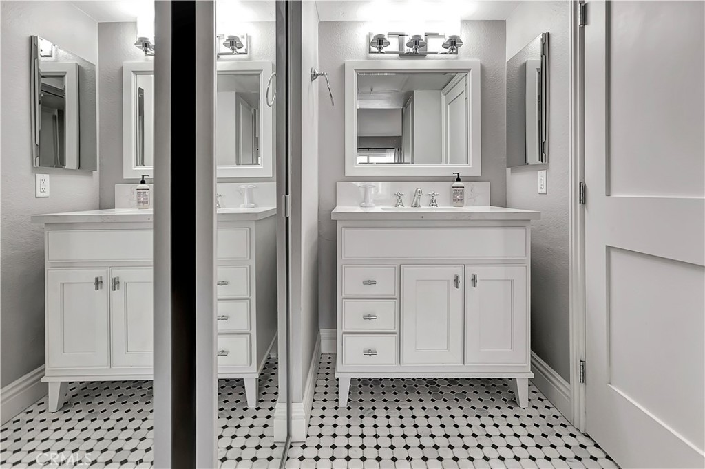 34014 Selva Road, Unit 19 Dana Point, CA 92629 - Photo 14 of 19 a bathroom with a sink and a mirror