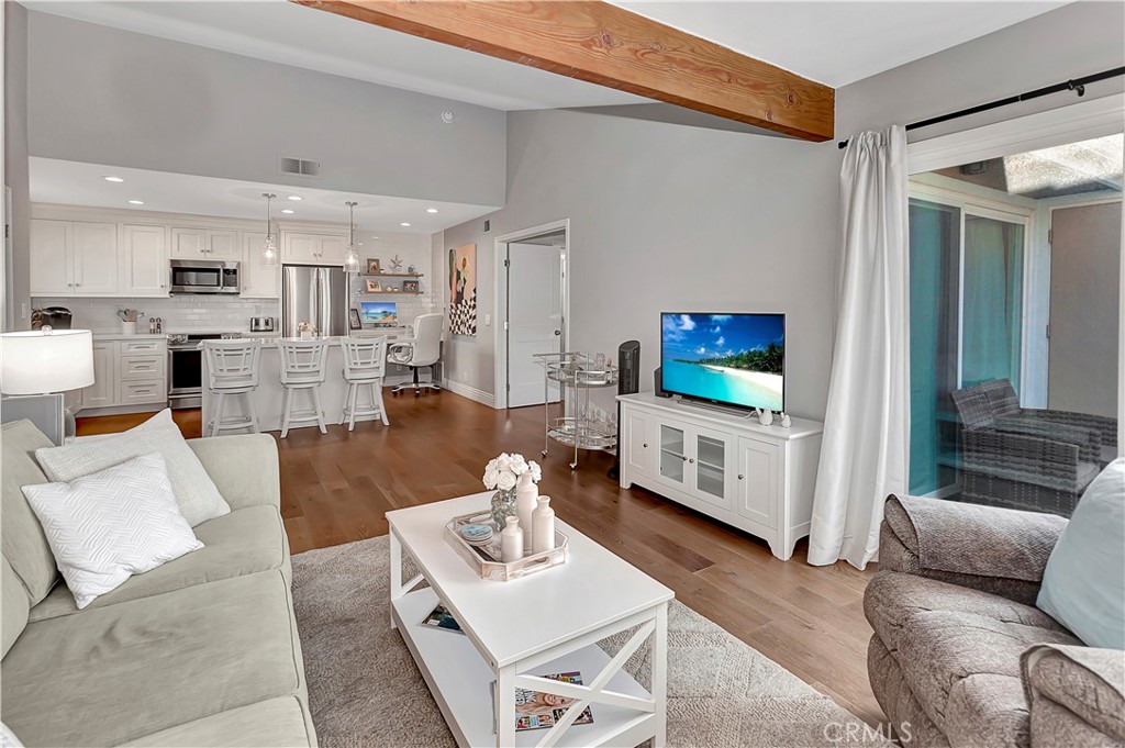 34014 Selva Road, Unit 19 Dana Point, CA 92629 - Photo 2 of 19 a living room with furniture and a flat screen tv