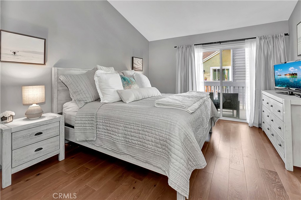 34014 Selva Road, Unit 19 Dana Point, CA 92629 - Photo 10 of 19 a bedroom with bed and flat tv screen on dresser