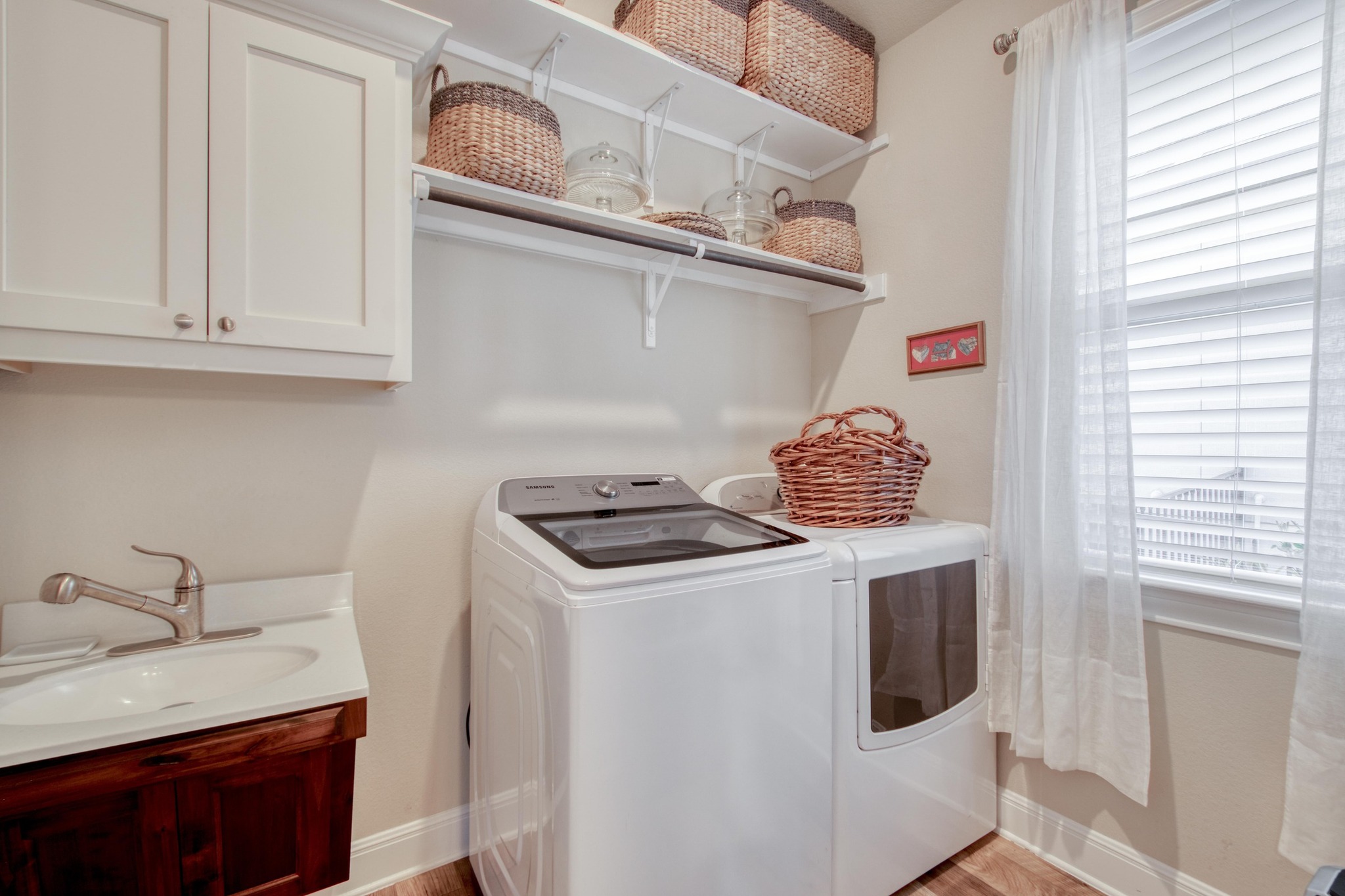 3204 Venezia View Leander, TX 78641 - Photo 22 of 28 Laundy off Kitchen area with ADA-accessible sink and storage