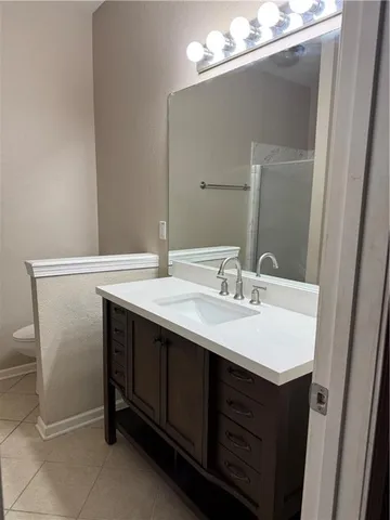 a bathroom with a sink a vanity and a mirror