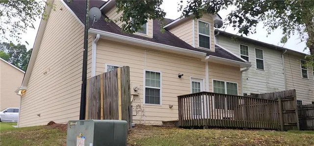 a view of a house with a fence