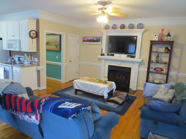 235 Steve Ridge Willow Spring, NC 27592 - Photo 8 of 25 Has gas log fireplace, hardwood floors and closet. Screened-In back porch and deck leading outside from the family room. Family Room