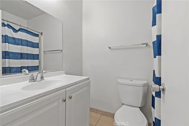 a bathroom with a toilet and a sink
