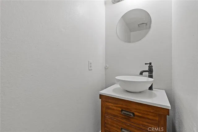 a view of a house with large windows and garage