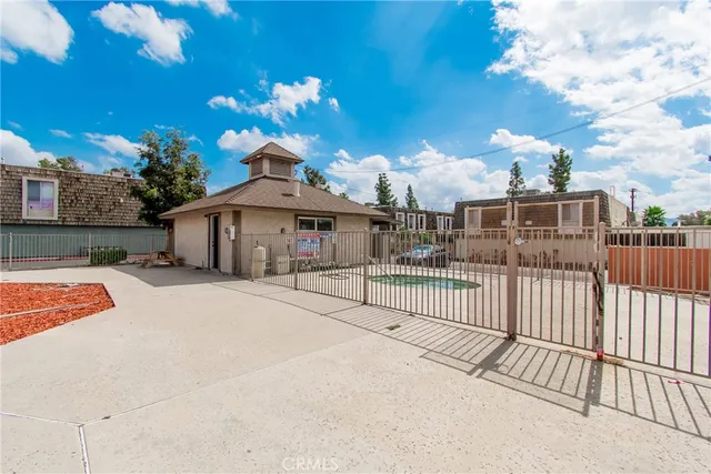 a view of a house with a iron fence