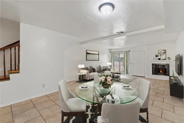 a dining room with furniture and a fireplace
