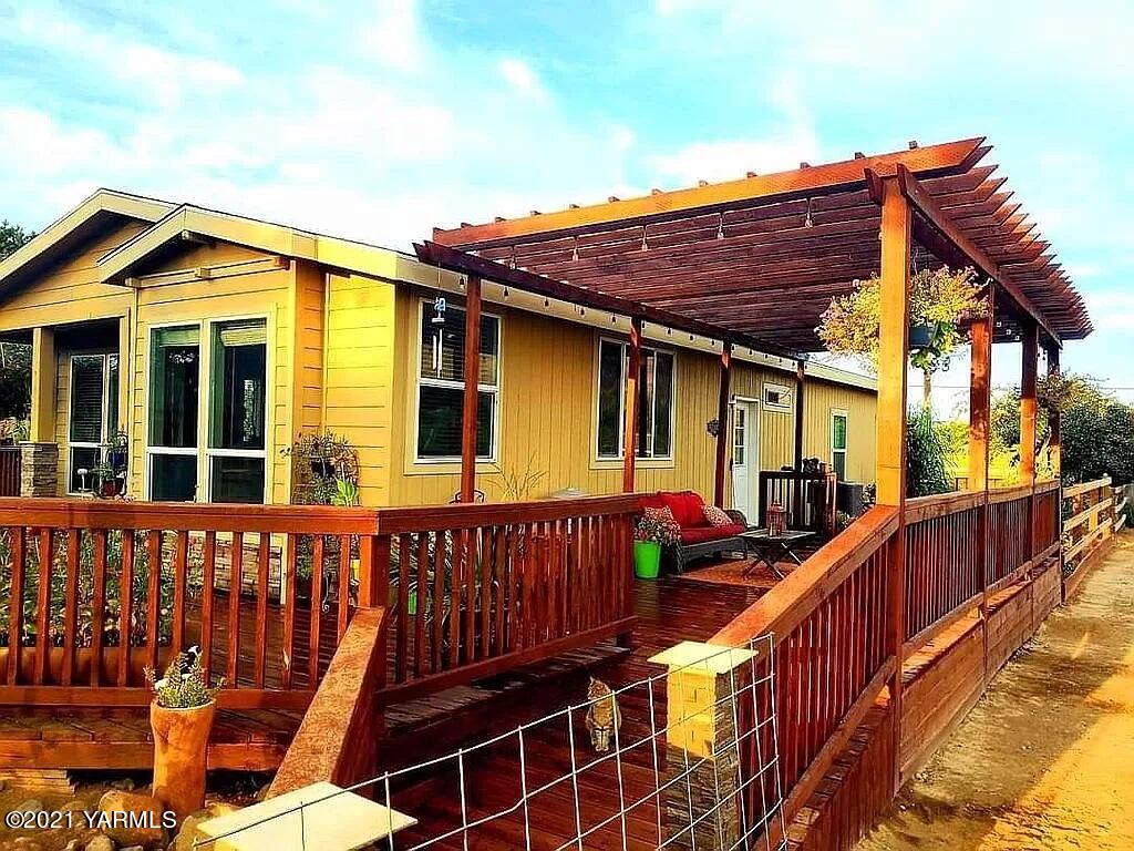 a view of a house with wooden deck