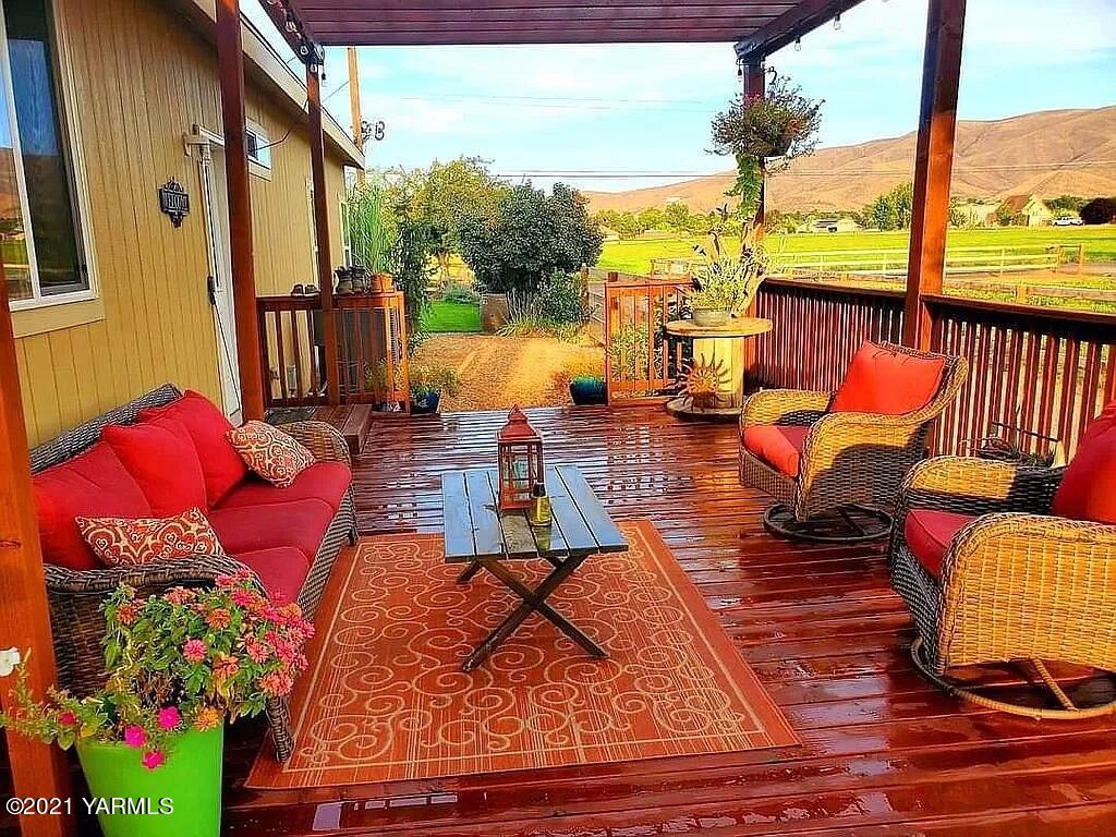 7302 South Moore Road Prosser, WA 99350 - Photo 5 of 24 a outdoor living space with furniture and a floor to ceiling window