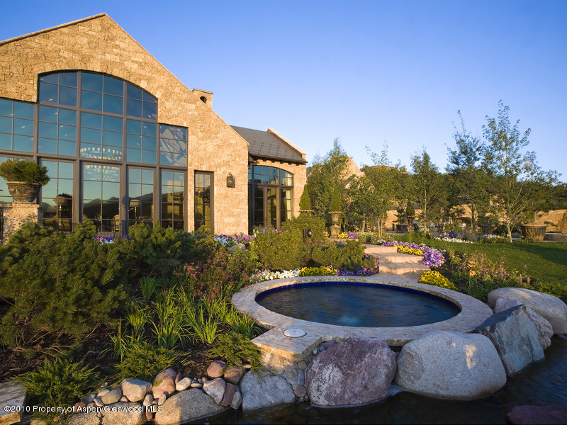 1518 West Buttermilk Road Aspen, CO 81611 - Photo 21 of 40 a view of a swimming pool with a patio