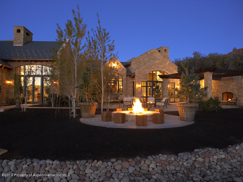 1518 West Buttermilk Road Aspen, CO 81611 - Photo 27 of 40 a view of a fountain in front of the house