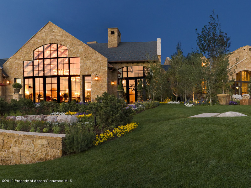 1518 West Buttermilk Road Aspen, CO 81611 - Photo 29 of 40 a front view of a house with garden