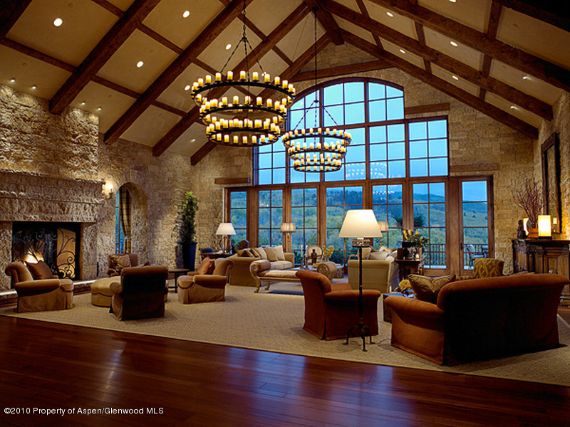 1518 West Buttermilk Road Aspen, CO 81611 - Photo 3 of 40 a living room with lots of furniture and chandelier
