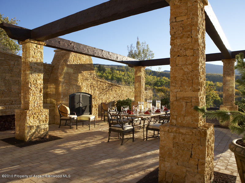 1518 West Buttermilk Road Aspen, CO 81611 - Photo 31 of 40 a view of a patio with table and chairs