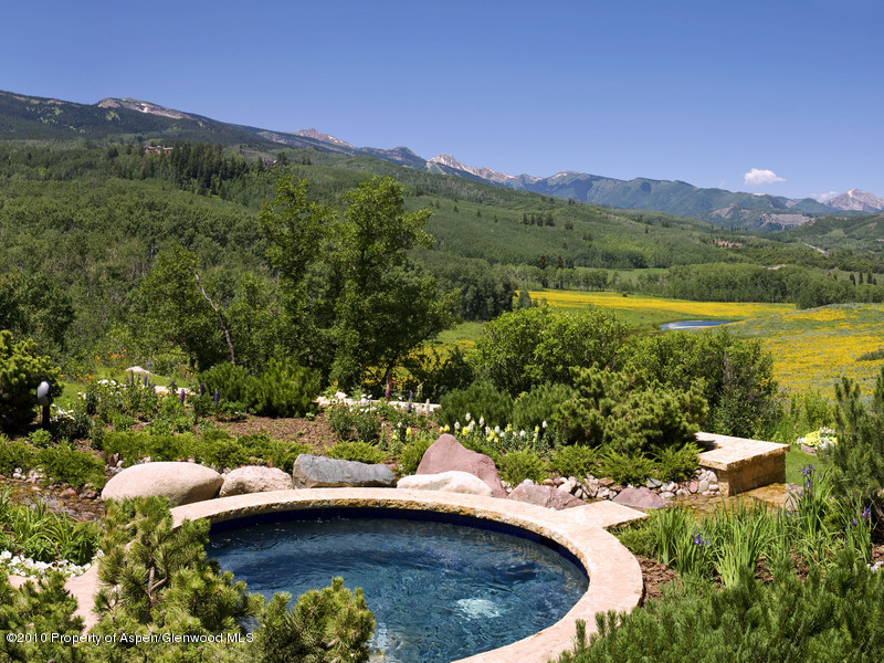 1518 West Buttermilk Road Aspen, CO 81611 - Photo 32 of 40 a view of a lake with a mountain in the background