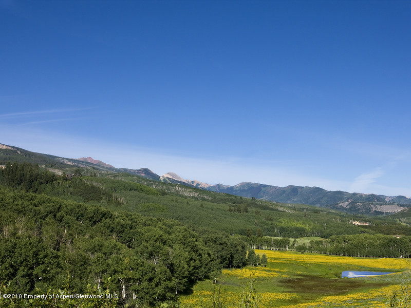 1518 West Buttermilk Road Aspen, CO 81611 - Photo 33 of 40 a view of a town with mountains in the background