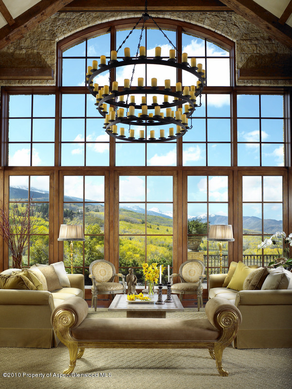 1518 West Buttermilk Road Aspen, CO 81611 - Photo 4 of 40 a living room with furniture and floor to ceiling windows