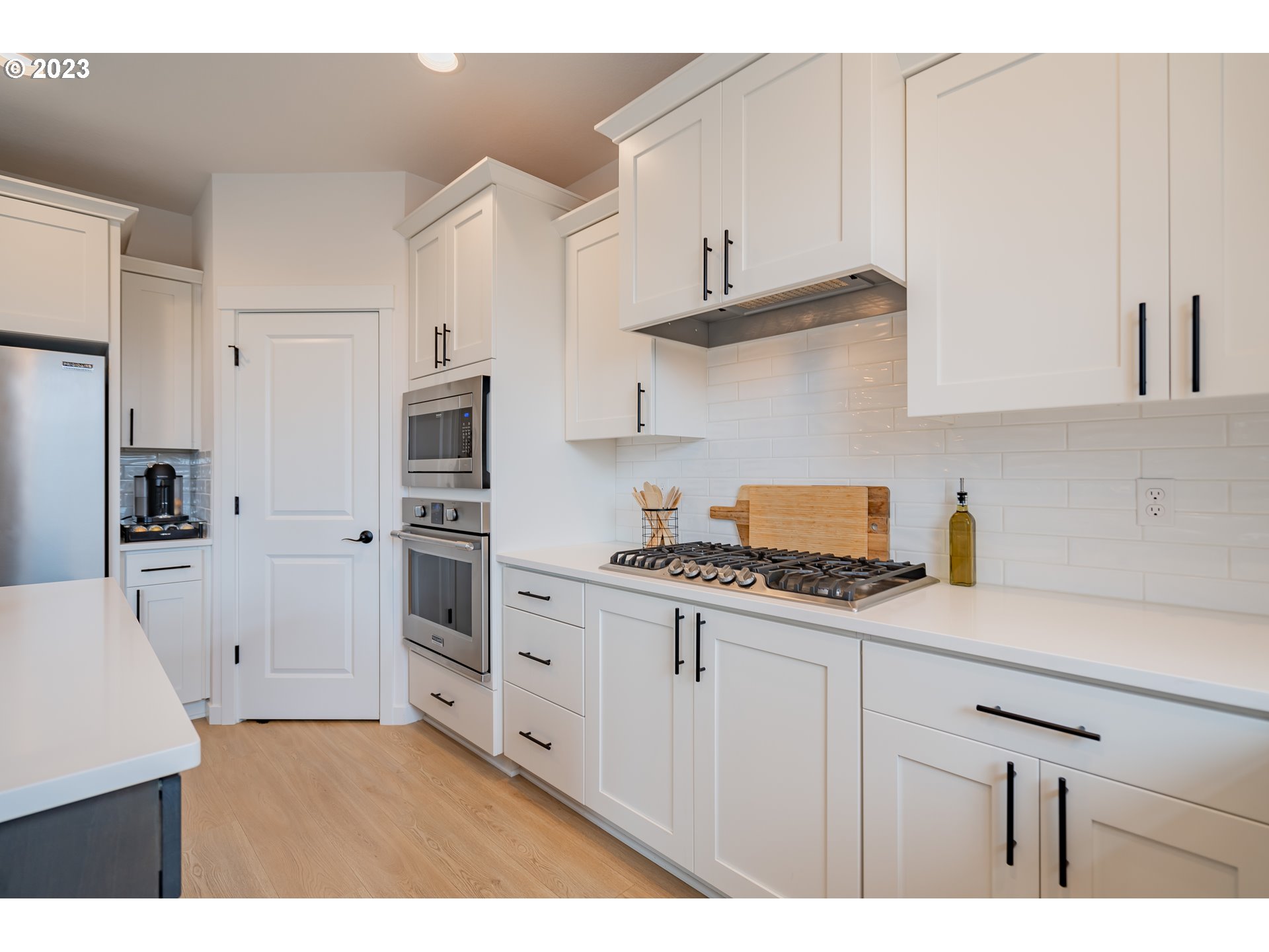 8719 North 1st Street Ridgefield, WA 98642 - Photo 15 of 45 a kitchen with stainless steel appliances a sink stove and refrigerator