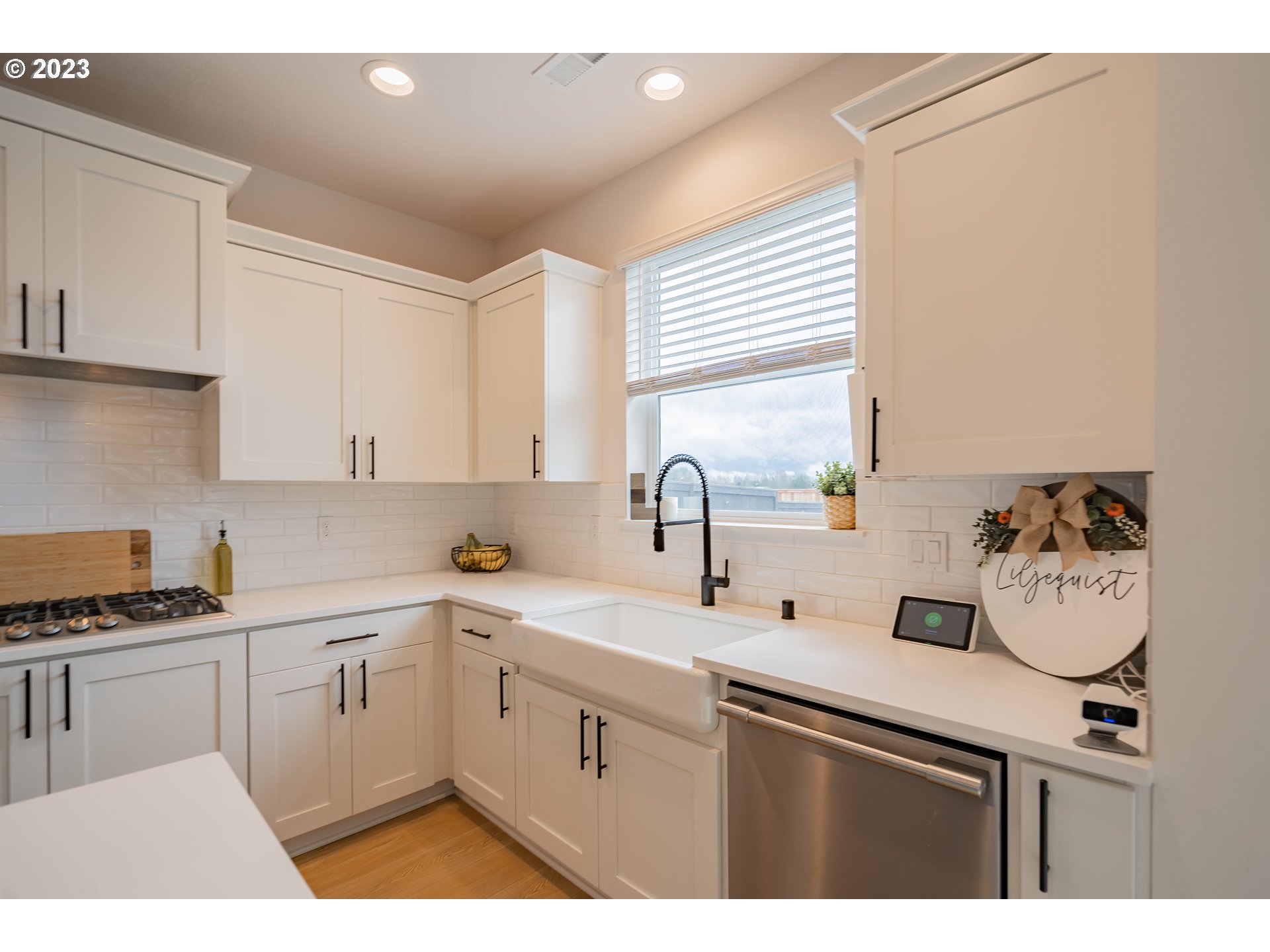 8719 North 1st Street Ridgefield, WA 98642 - Photo 16 of 45 a kitchen with a sink and cabinets