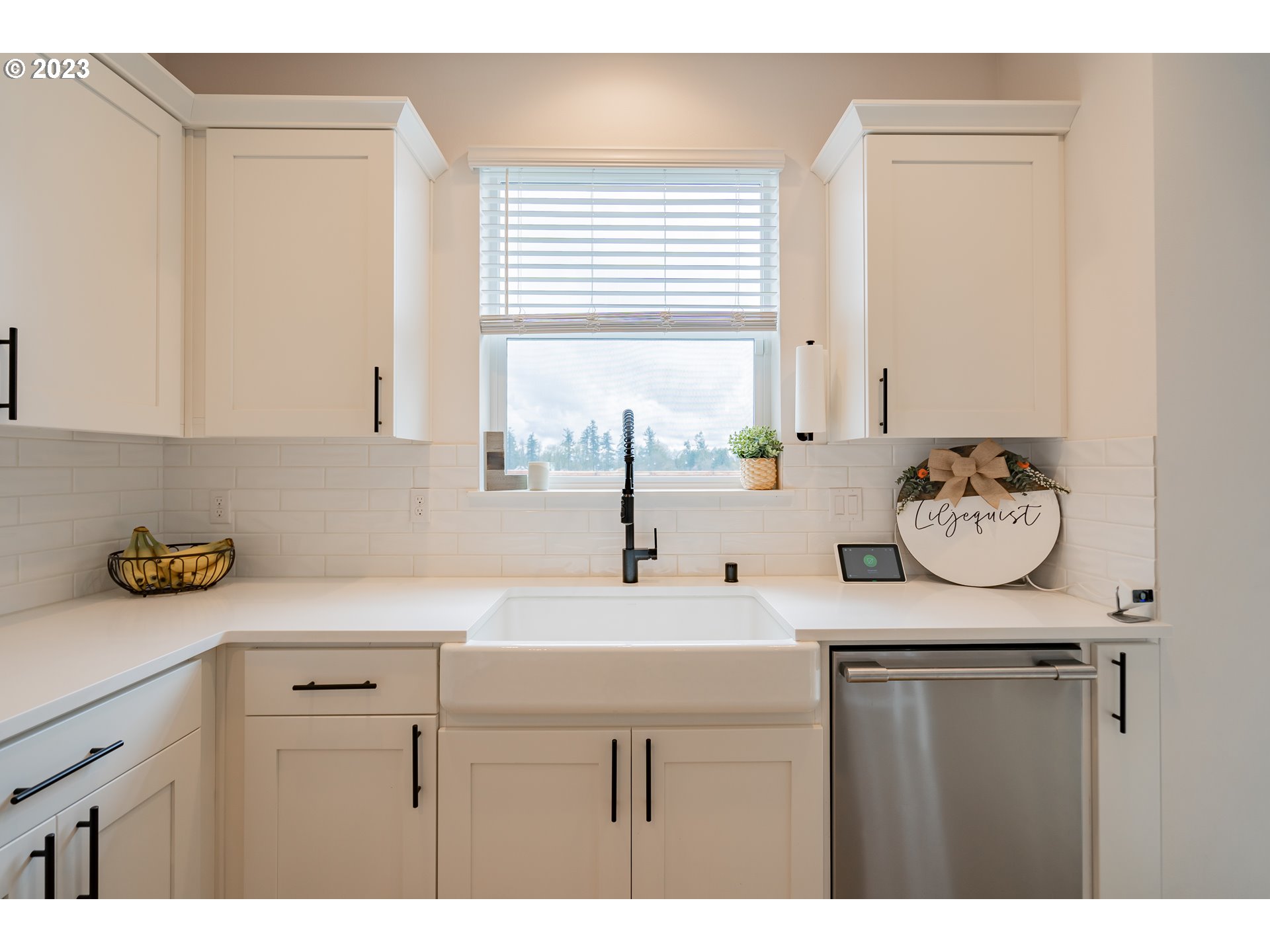 8719 North 1st Street Ridgefield, WA 98642 - Photo 17 of 45 a kitchen with a sink and cabinets
