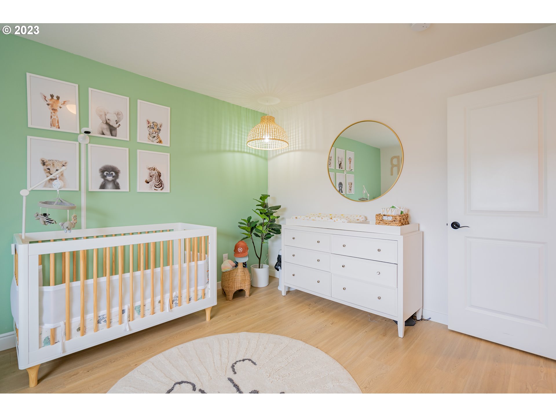 8719 North 1st Street Ridgefield, WA 98642 - Photo 24 of 45 a view of a bedroom with baby bed and workspace