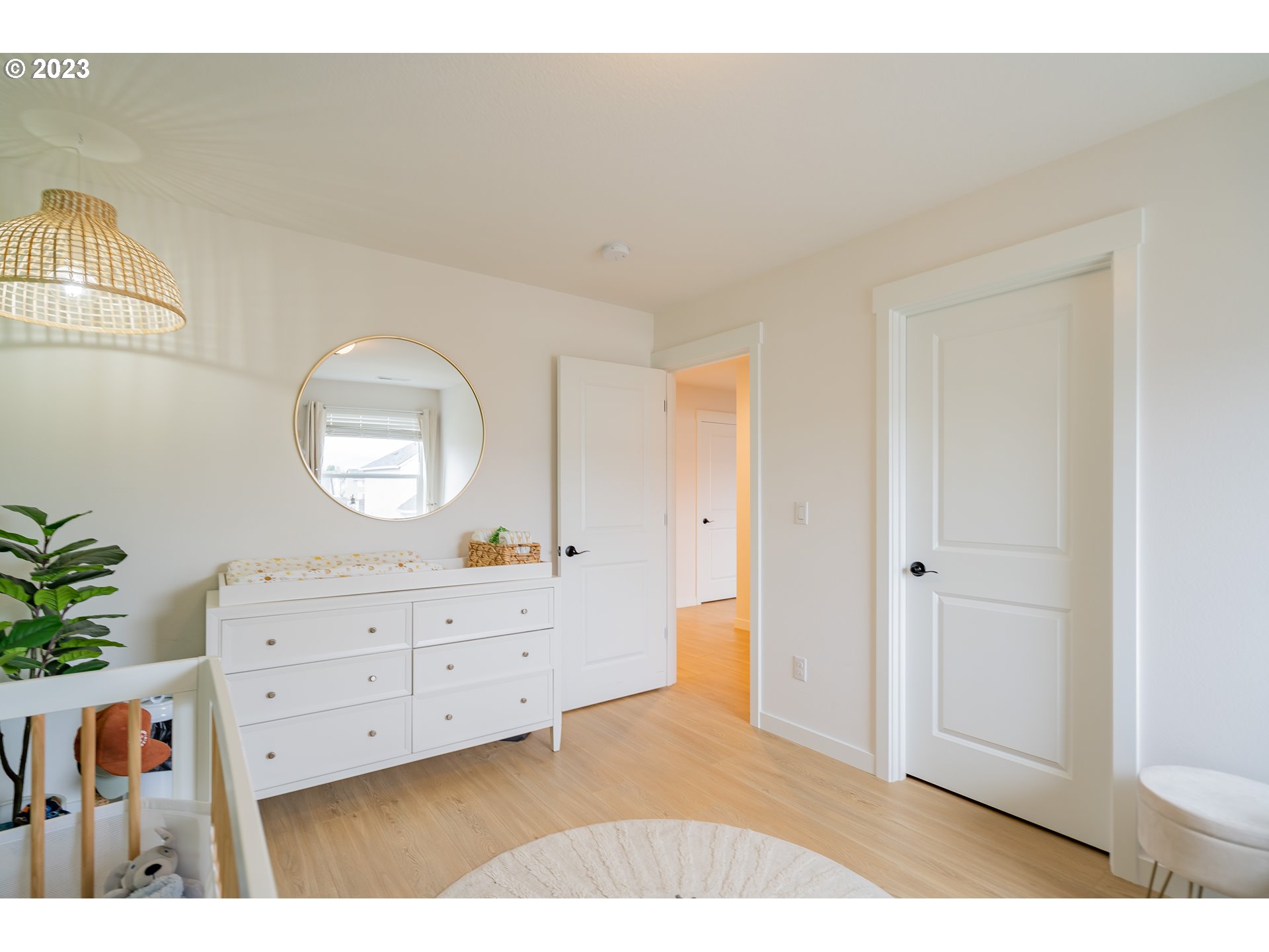 8719 North 1st Street Ridgefield, WA 98642 - Photo 25 of 45 a view of a cabinet and mirror in a room