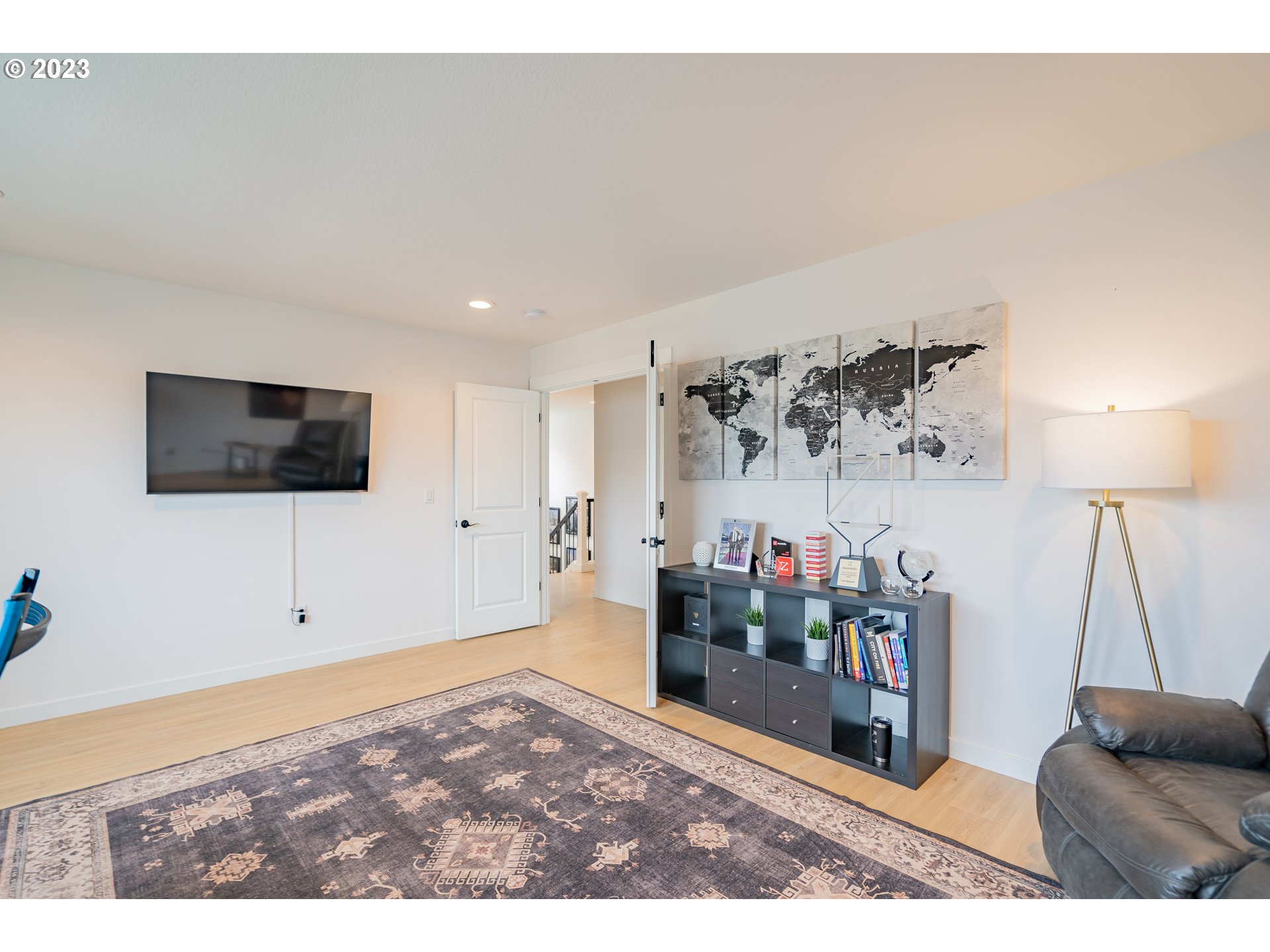 8719 North 1st Street Ridgefield, WA 98642 - Photo 30 of 45 a view of a livingroom with furniture and a flat screen tv