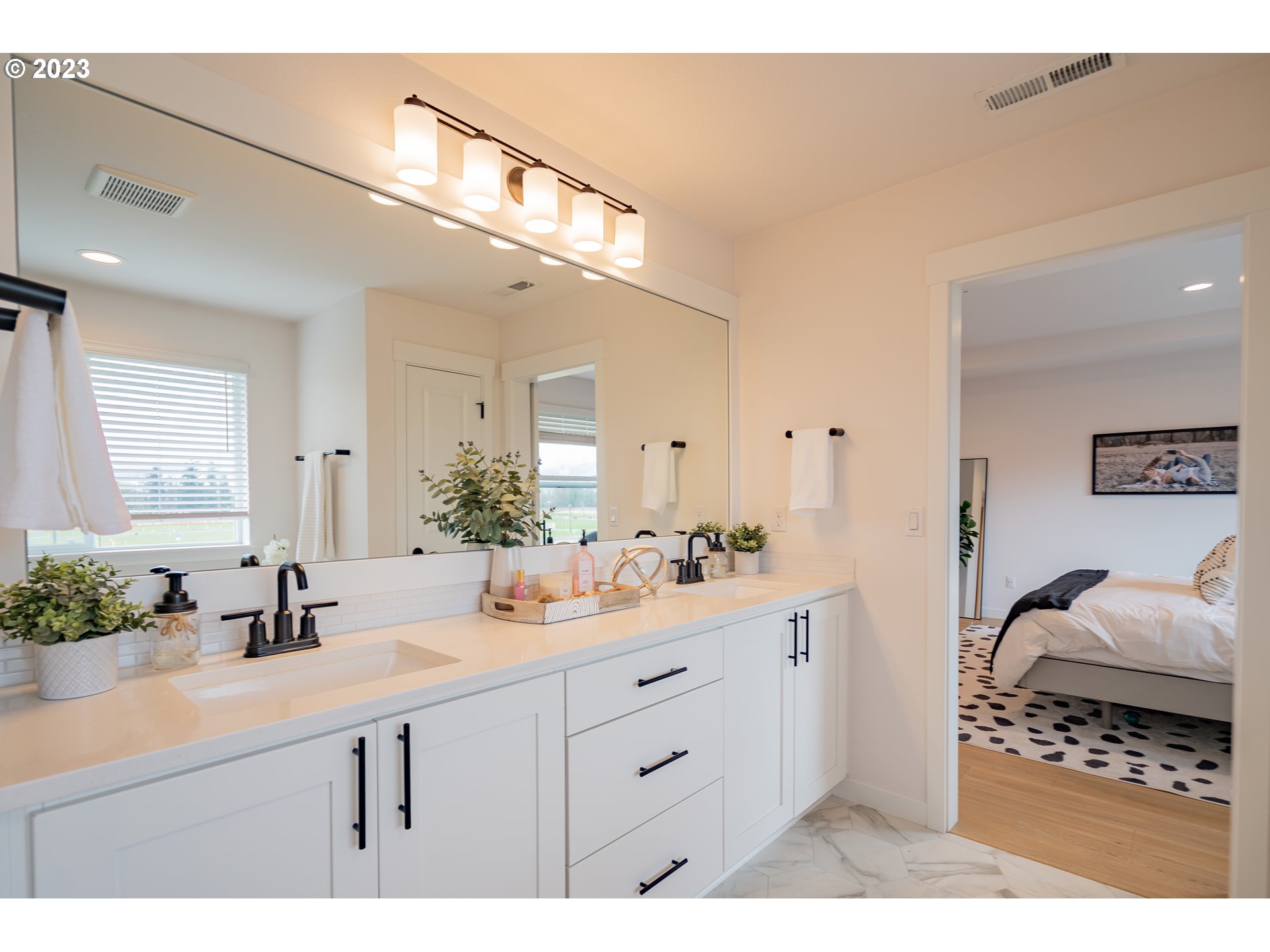 8719 North 1st Street Ridgefield, WA 98642 - Photo 39 of 45 a bathroom with a sink double vanity and a mirror