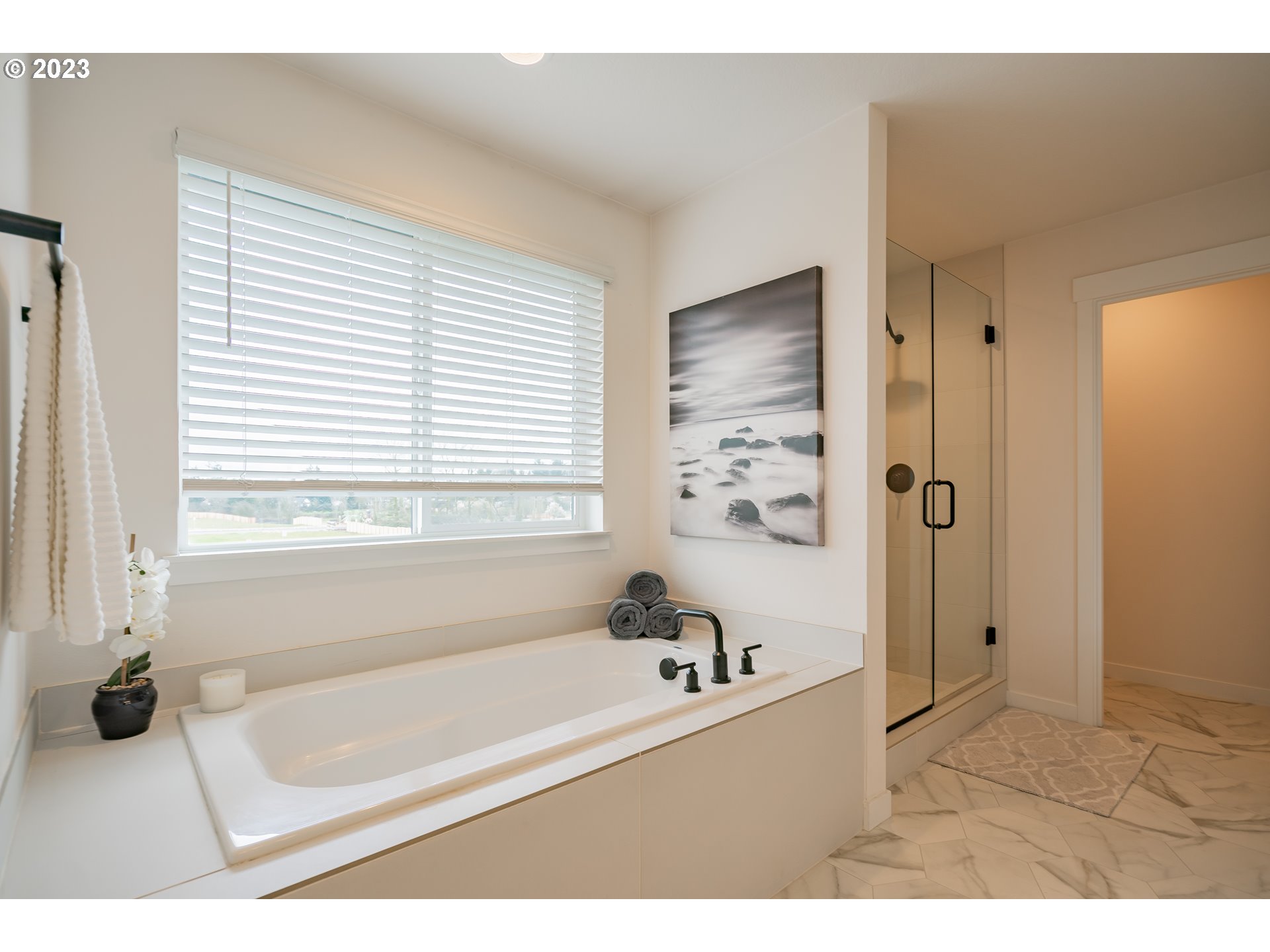 8719 North 1st Street Ridgefield, WA 98642 - Photo 41 of 45 a bathroom with a bathtub and a shower