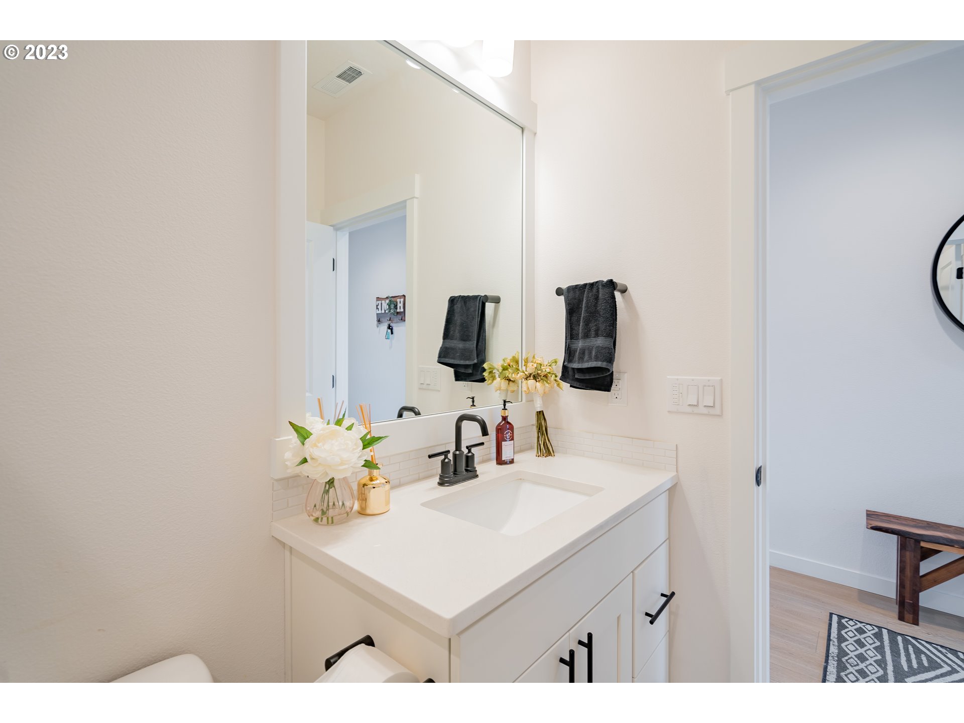 8719 North 1st Street Ridgefield, WA 98642 - Photo 6 of 45 a bathroom with a sink vanity and a mirror